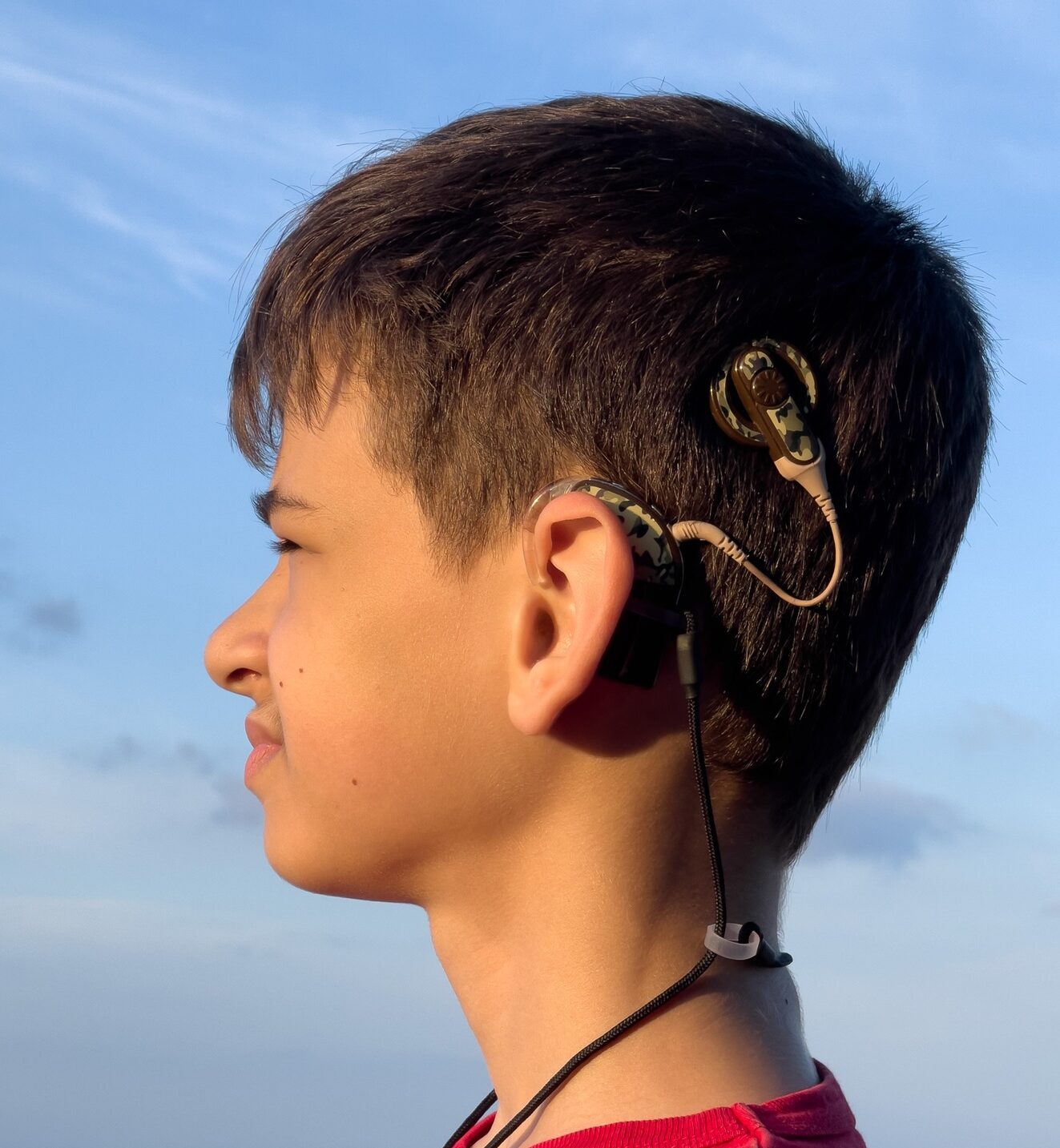 deaf boy with cochlear implant